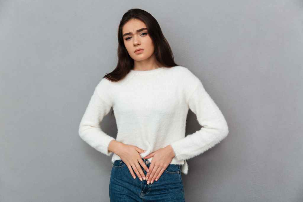 young teenager woman with stomachache 1