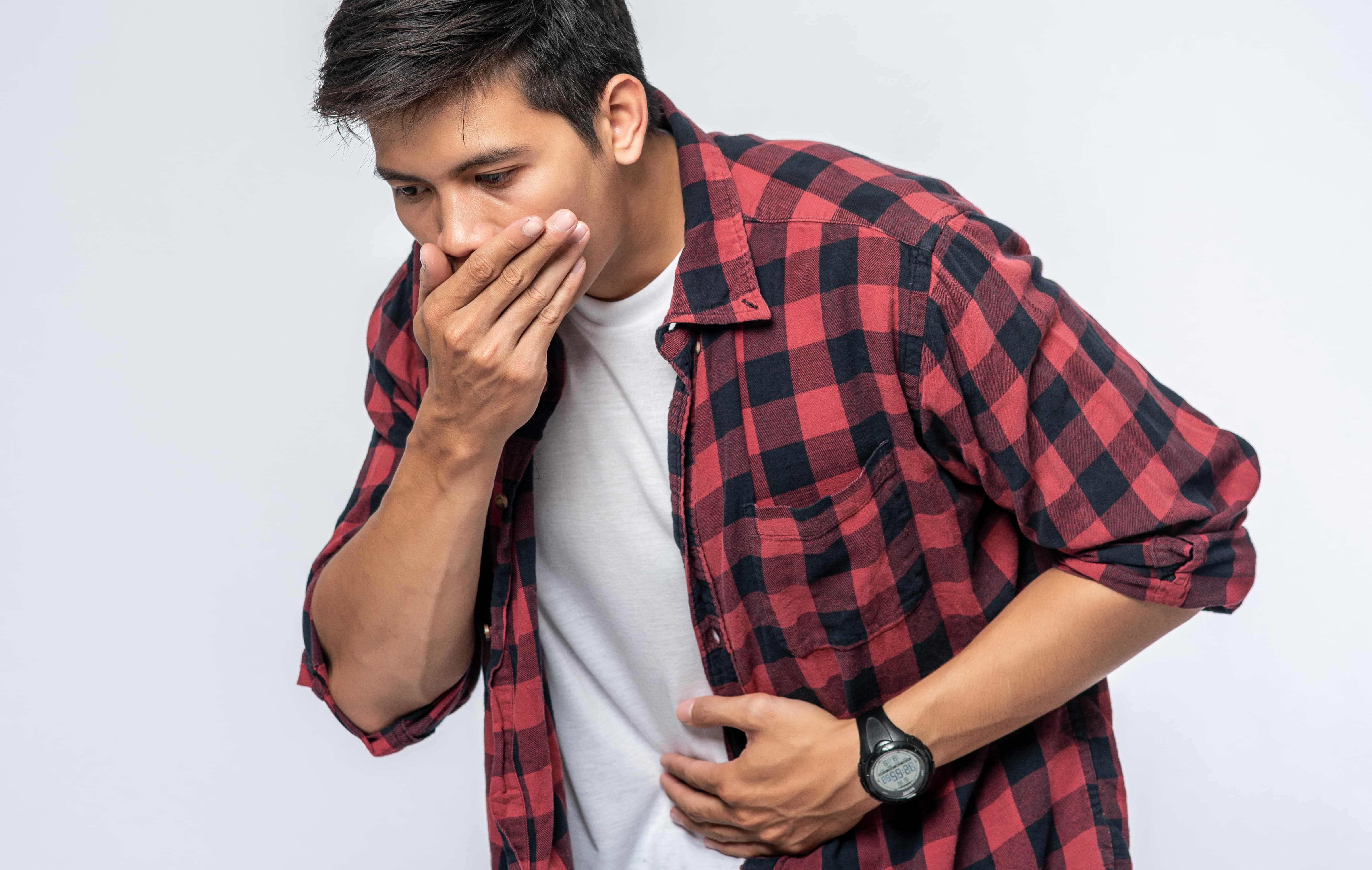 man-standing-with-stomachache-put-your-hands-your-stomach-cover-your-mouth (1)