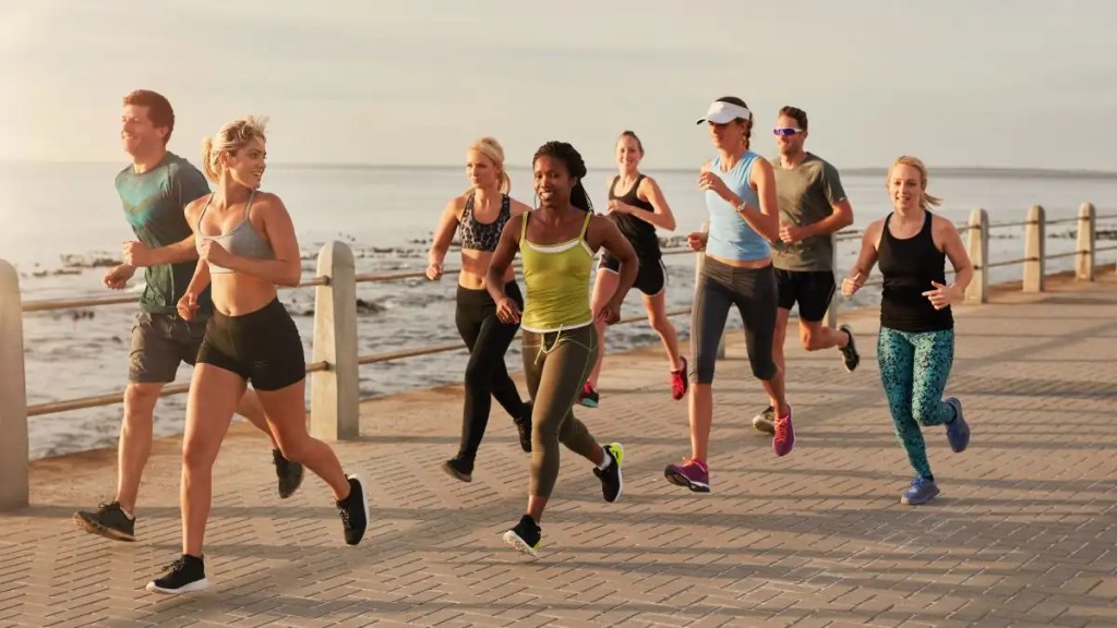 group-running-outdoors-fitness-training-coastal-path