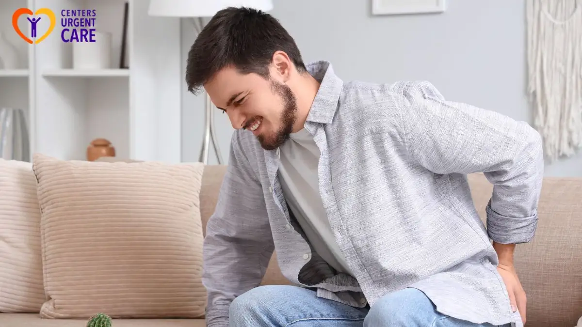 man-experiencing-lower-back-pain-at-home-discomfort