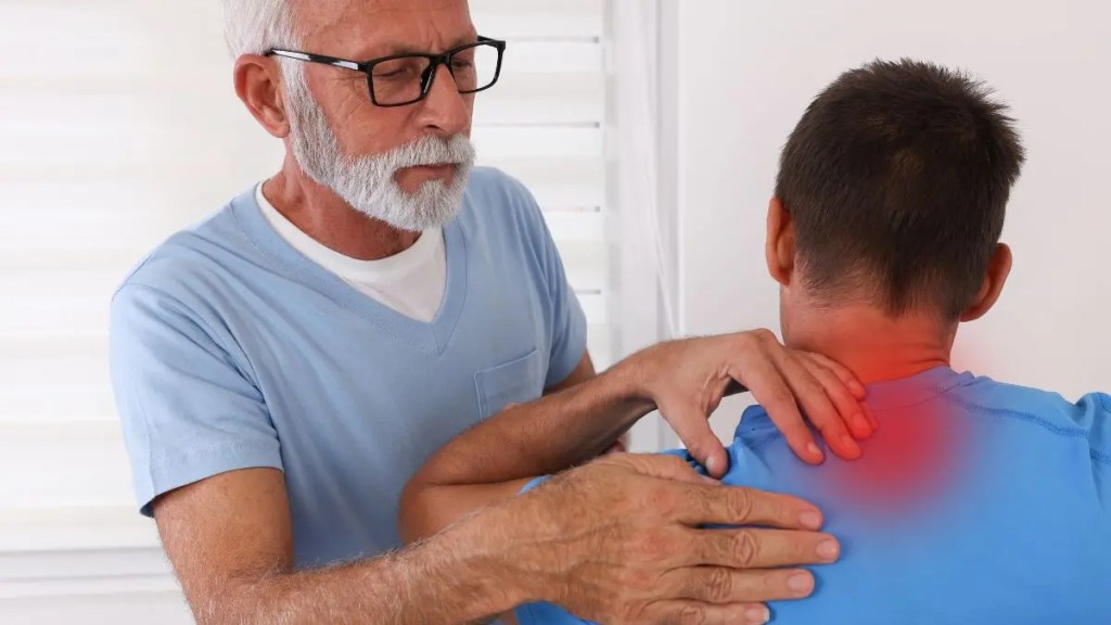 physical-therapy-neck-pain-treatment-man-shoulder-exam