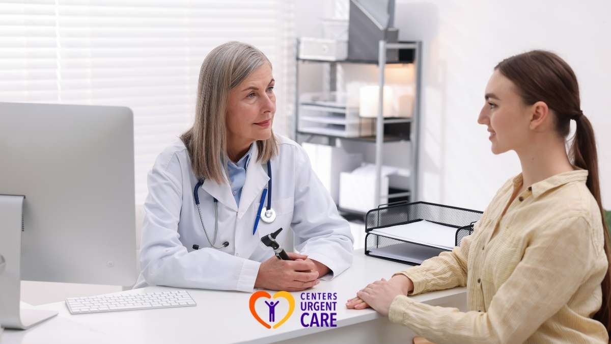 patient-consulting-with-doctor-at-clinic-desk